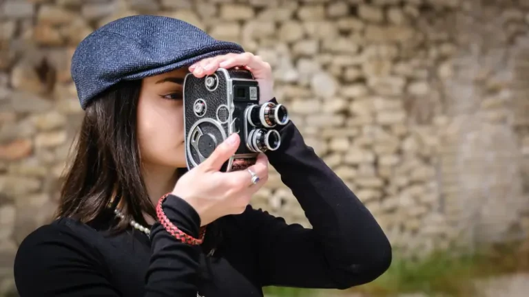 Vintage portrait of a girl and her movie camera — CLAIRE Magazine, August 2026